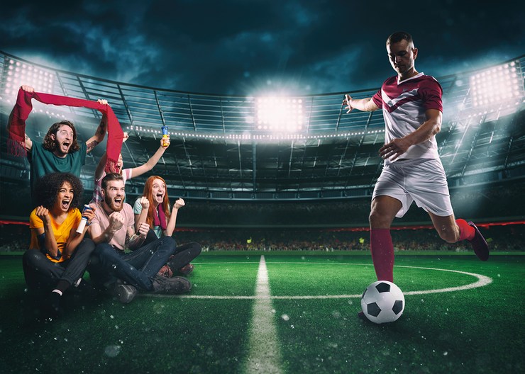 Football Fans on Pitch with Player
