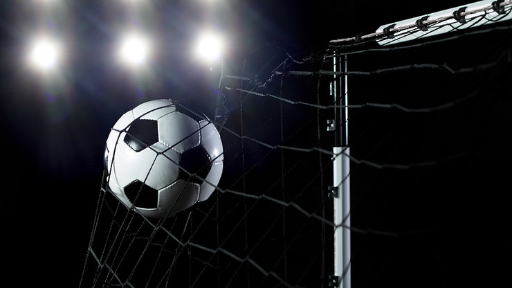 Football Flying Into Net Dark Background
