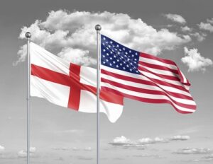 England and USA Flags Against Grey Sky