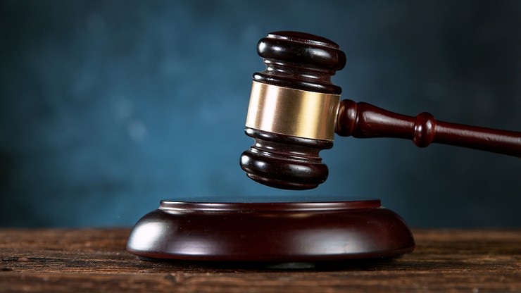 Gavel Against Dark Blue Background