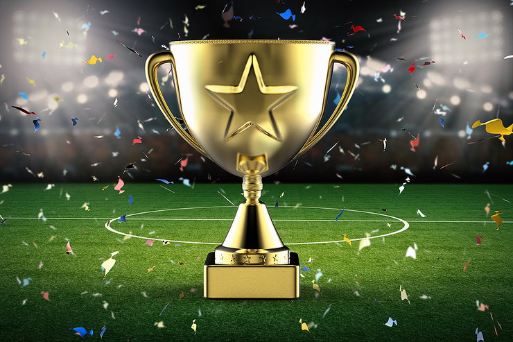 Gold Star Trophy on Football Pitch