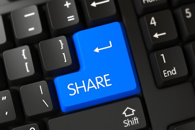 Blue Share Keyboard Button on Black Keyboard