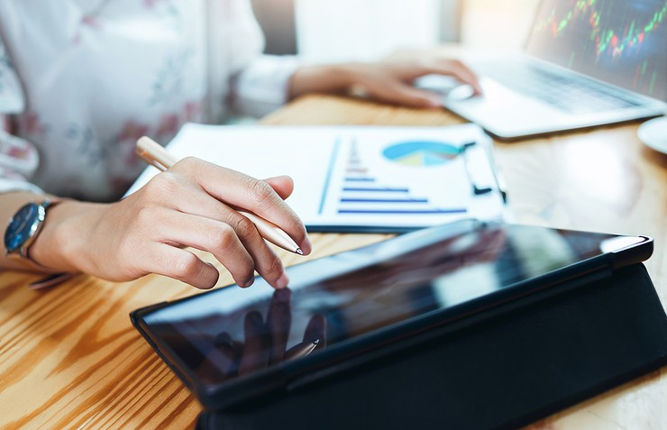 Data Analyst Using Laptop and Tablet