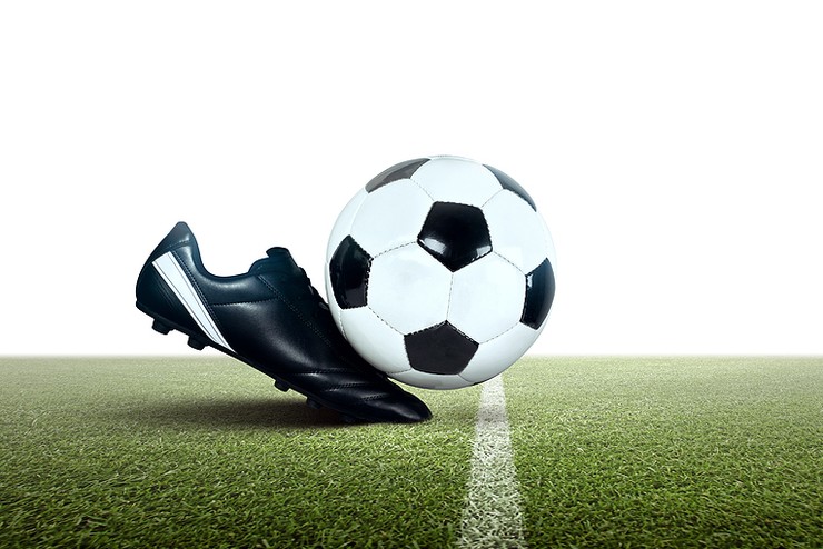 Traditional Football Boot and Ball Isolated on Pitch