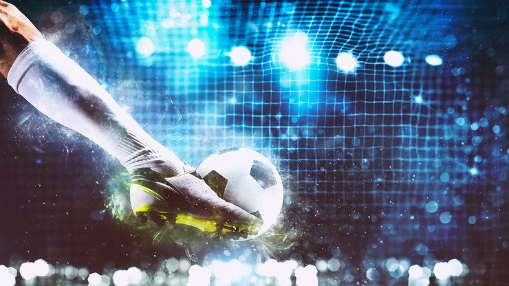 Leg of Footballer Scoring in Open Goal