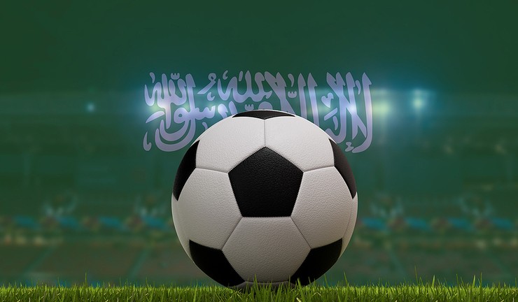 Football in Stadium Double Exposed with Saudi Flag