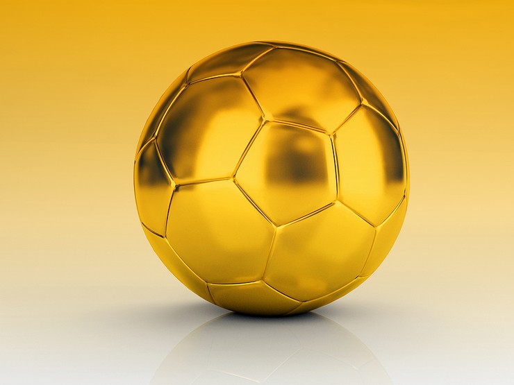 Gold Football Against Gold Background